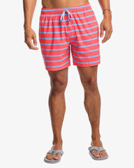 The front view of the Southern Tide Bayshore Stripe Printed Swim Trunk by Southern Tide - Sunkist Coral