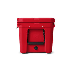 YETI Tundra 65 Hard Cooler in Rescue Red, full side view with side handle and water drain.