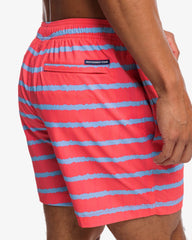 The back pocket view of the Southern Tide Bayshore Stripe Printed Swim Trunk by Southern Tide - Sunkist Coral