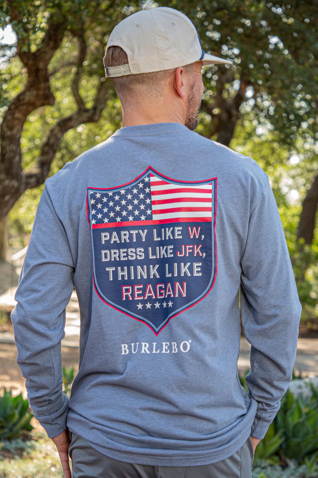 Burlebo blue long sleeve t-shirt with "party like W, dress like JFK, think like Regan" on the back