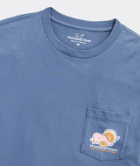 Close up of a Vineyard Vines blue pocket t-shirt with a Thanksgiving whale logo